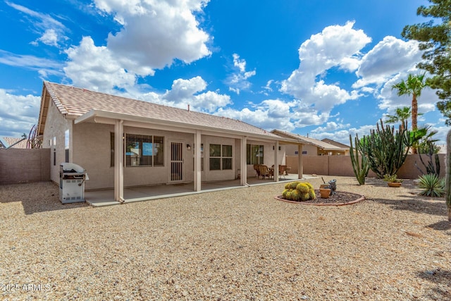 6372 S Callaway Dr, Chandler, AZ 85249 - rear view of property with a fenced backyard, a patio, and stucco siding