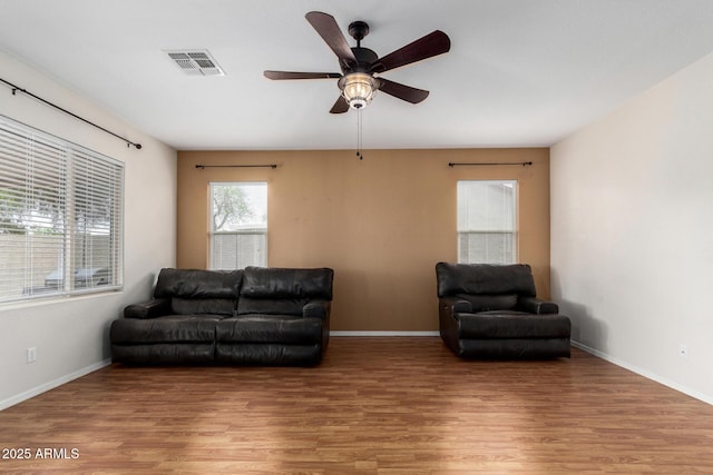 6372 S Callaway Dr, Chandler, AZ 85249 - living area with light wood-type flooring, ceiling fan, baseboards, and visible vents