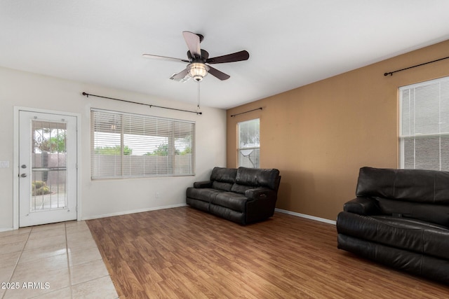 6372 S Callaway Dr, Chandler, AZ 85249 - living area featuring light wood-style flooring, baseboards, and ceiling fan