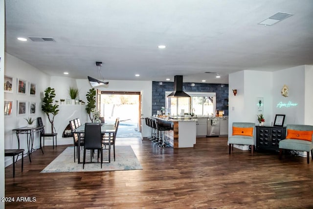 dining space with dark hardwood / wood-style floors and sink