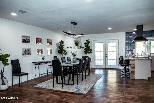 dining space with french doors and dark hardwood / wood-style floors