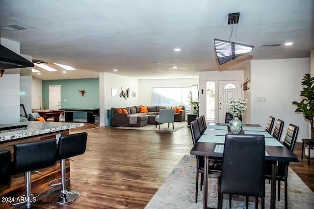 dining room featuring hardwood / wood-style flooring and pool table