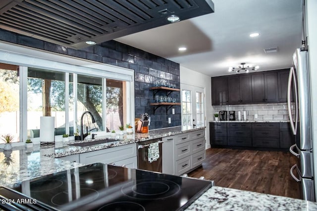 kitchen featuring sink, tasteful backsplash, dark brown cabinets, white cabinetry, and stainless steel appliances