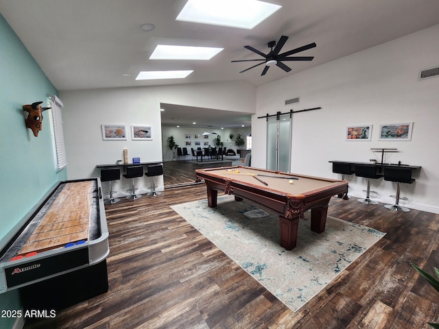 recreation room featuring ceiling fan, a barn door, dark hardwood / wood-style floors, lofted ceiling, and pool table