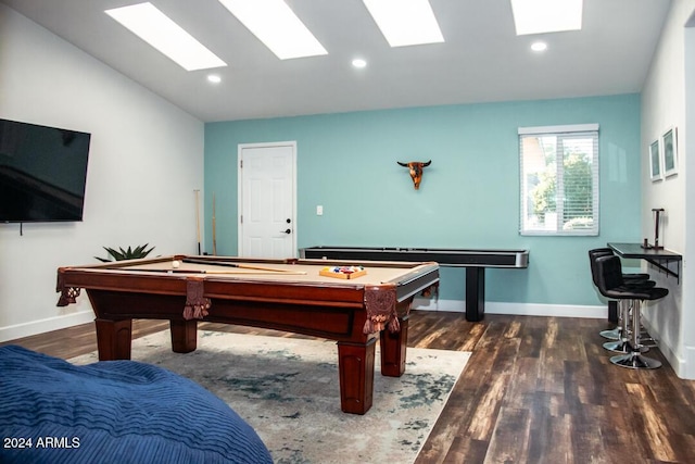 rec room featuring lofted ceiling with skylight, dark hardwood / wood-style floors, and pool table