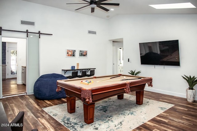 rec room featuring a barn door, ceiling fan, dark hardwood / wood-style flooring, and billiards