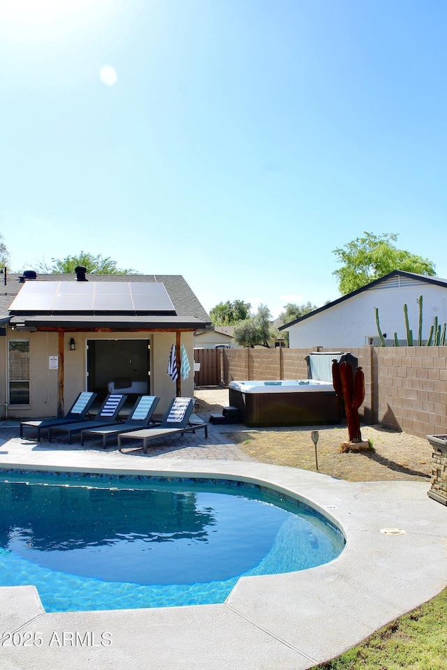 view of pool featuring a patio and a hot tub