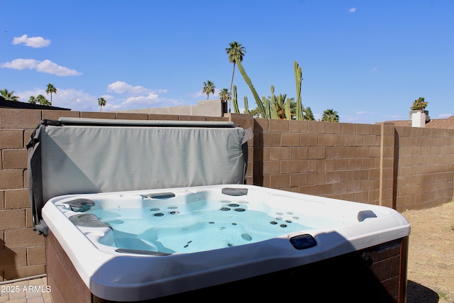 exterior space featuring a hot tub