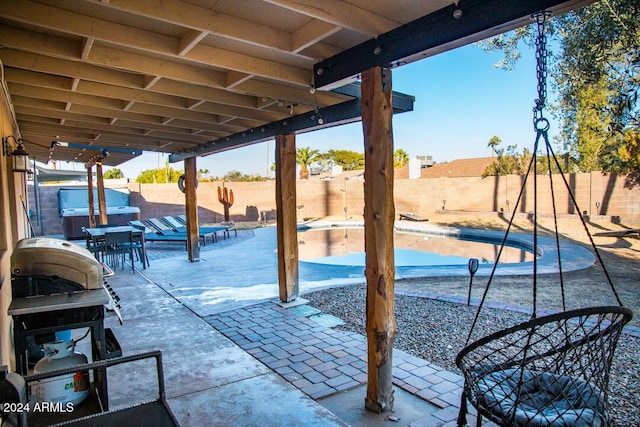 view of patio / terrace with a fenced in pool