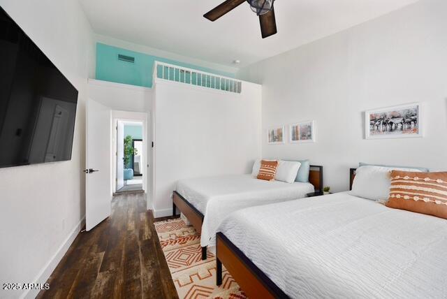 bedroom featuring ceiling fan and dark hardwood / wood-style flooring