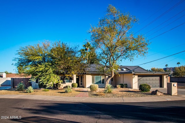 ranch-style home with a garage