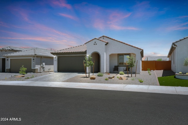 mediterranean / spanish-style home featuring a garage