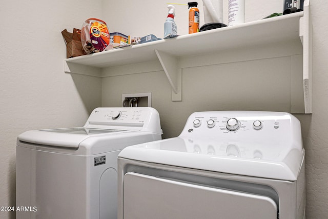 clothes washing area with separate washer and dryer and hookup for a washing machine