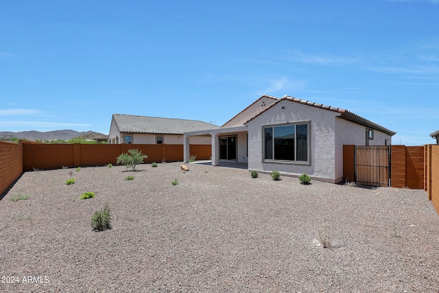 back of property featuring a patio area