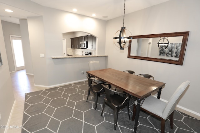 7021 E Earll Dr Unit 204, Scottsdale, AZ 85251 - dining area with a chandelier, baseboards, and recessed lighting