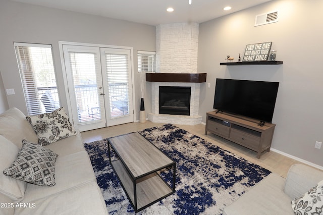 7021 E Earll Dr Unit 204, Scottsdale, AZ 85251 - living area with a fireplace, recessed lighting, and baseboards