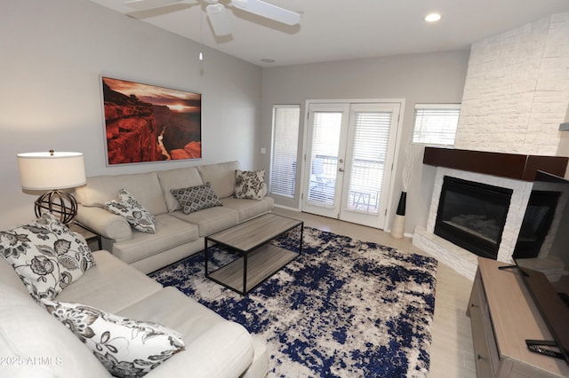 7021 E Earll Dr Unit 204, Scottsdale, AZ 85251 - living area with a ceiling fan, a fireplace, recessed lighting, and baseboards