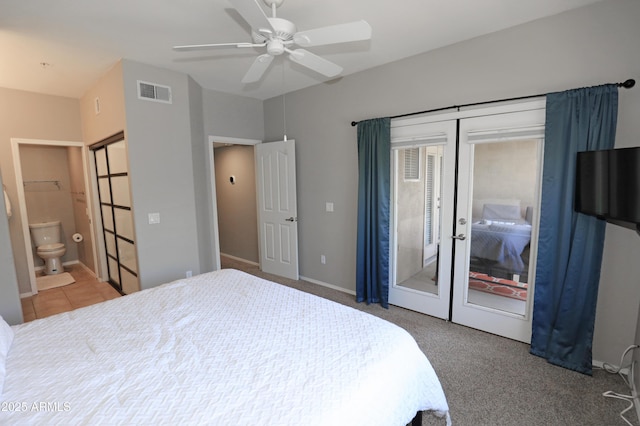 7021 E Earll Dr Unit 204, Scottsdale, AZ 85251 - carpeted bedroom featuring french doors, access to exterior, ceiling fan, ensuite bathroom, and baseboards