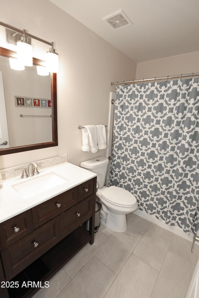 7021 E Earll Dr Unit 204, Scottsdale, AZ 85251 - full bath with vanity, toilet, a shower with shower curtain, and tile patterned floors