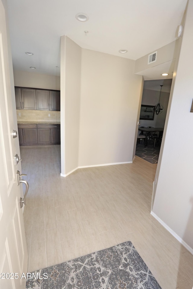 7021 E Earll Dr Unit 204, Scottsdale, AZ 85251 - corridor featuring baseboards, recessed lighting, and light wood-style flooring