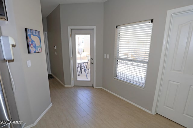 7021 E Earll Dr Unit 204, Scottsdale, AZ 85251 - foyer featuring light wood-style floors and baseboards