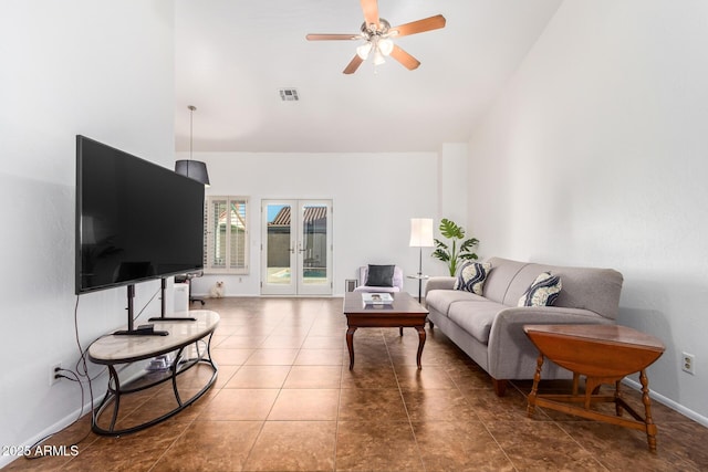 living room with high vaulted ceiling, tile patterned floors, french doors, and ceiling fan