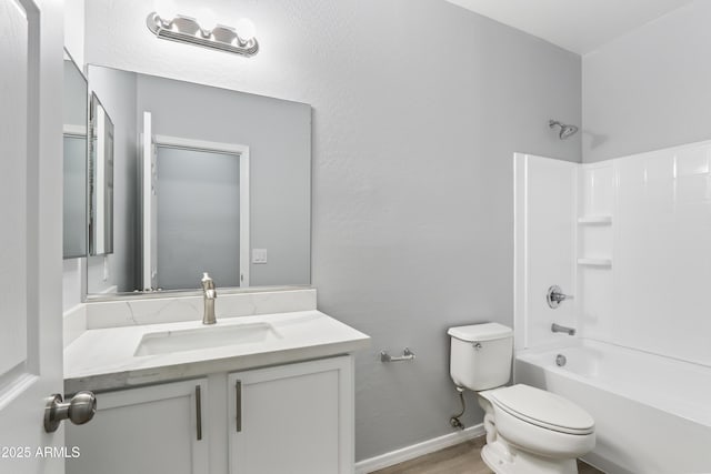 full bathroom featuring vanity, toilet, baseboards, washtub / shower combination, and wood finished floors