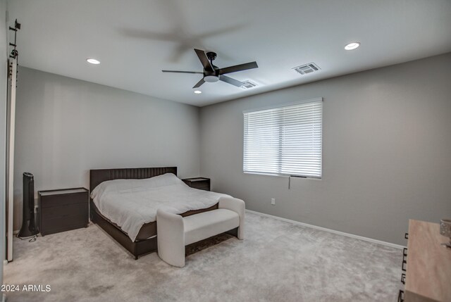 carpeted bedroom with ceiling fan