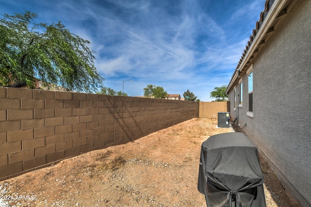 view of yard with central AC