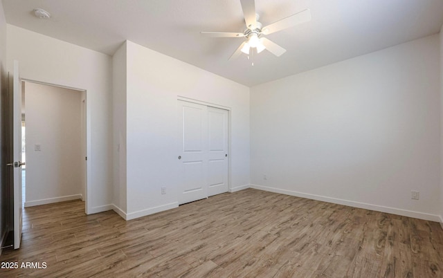 unfurnished bedroom with a closet, ceiling fan, and hardwood / wood-style floors