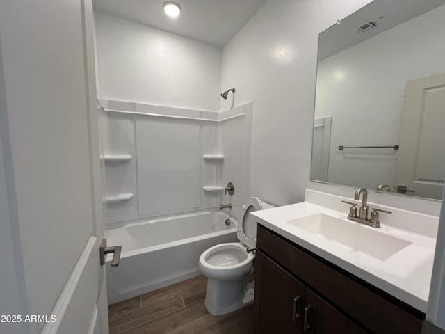 full bathroom featuring vanity, visible vents, wood tiled floor, tub / shower combination, and toilet