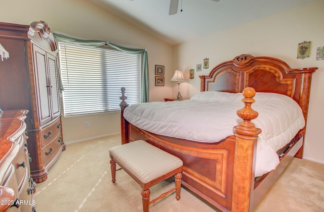 carpeted bedroom with ceiling fan and lofted ceiling