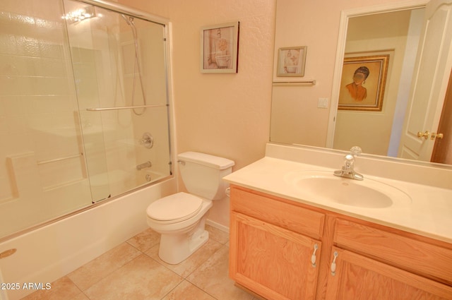 full bathroom featuring enclosed tub / shower combo, vanity, toilet, and tile patterned flooring