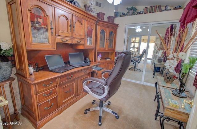 office area with light colored carpet and ceiling fan