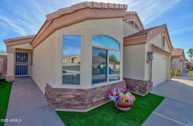 view of side of home featuring a garage