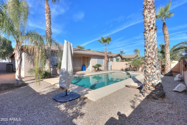 view of pool featuring a patio area and central AC