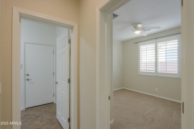 corridor with light colored carpet