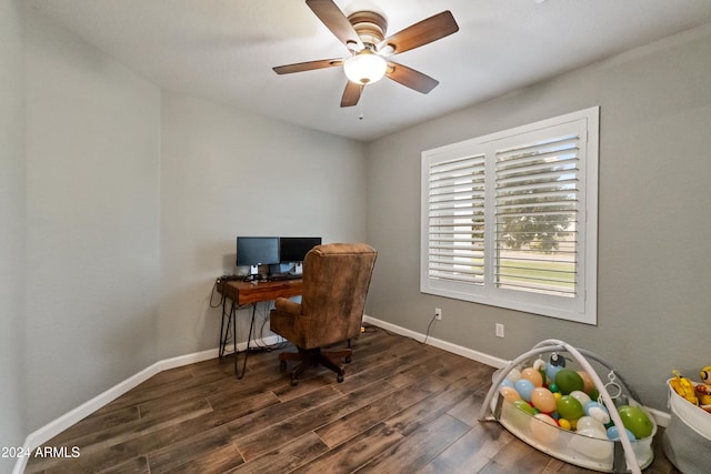 home office featuring a ceiling fan, baseboards, and dark wood-style flooring