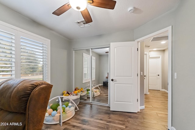 rec room featuring a wealth of natural light, visible vents, and wood finished floors