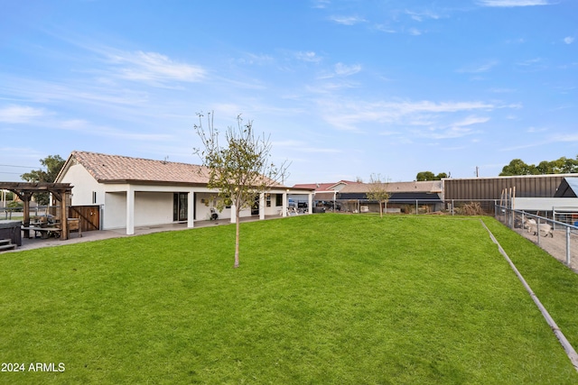 view of yard featuring fence, a patio, and a pergola