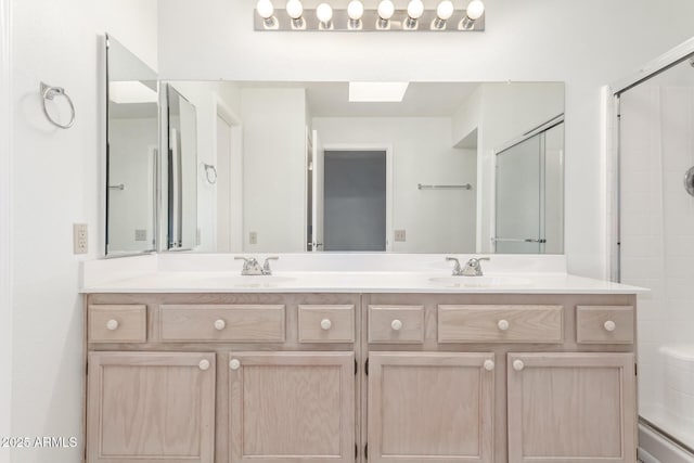 bathroom with vanity and walk in shower