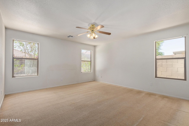 2421 W Romley Rd, Phoenix, AZ 85041 - empty room featuring light colored carpet, a ceiling fan, and baseboards