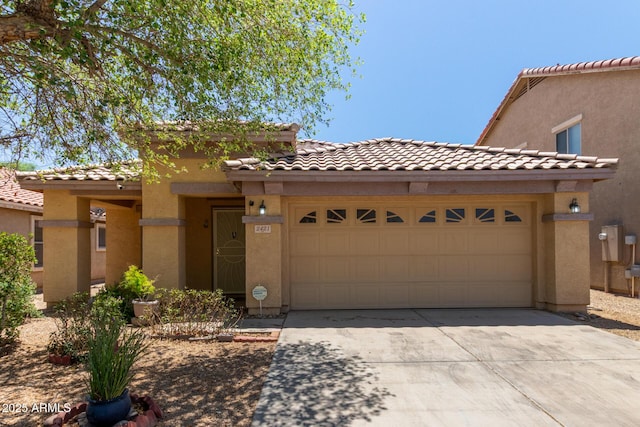 2421 W Romley Rd, Phoenix, AZ 85041 - view of front of property with an attached garage, driveway, and a tile roof