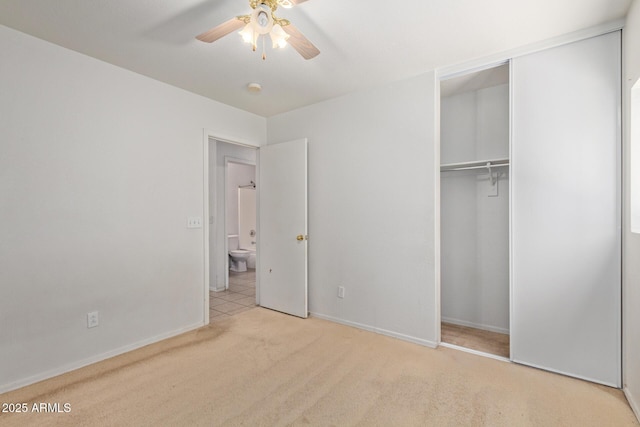 2421 W Romley Rd, Phoenix, AZ 85041 - unfurnished bedroom with carpet floors, a closet, baseboards, and a ceiling fan
