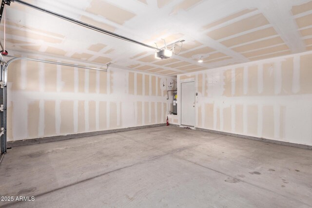 2421 W Romley Rd, Phoenix, AZ 85041 - garage featuring electric water heater and a garage door opener