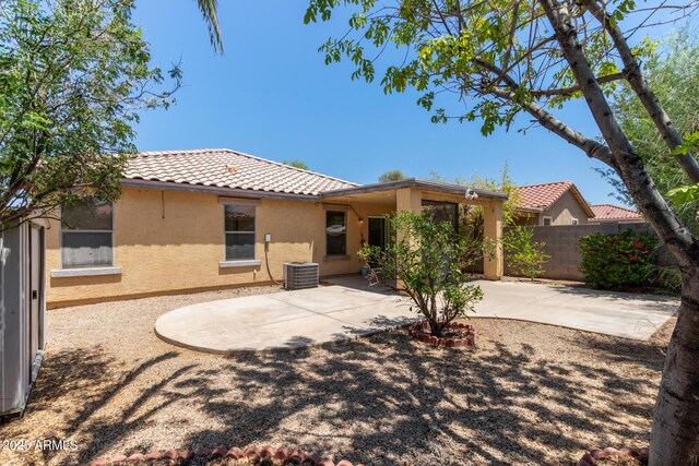 2421 W Romley Rd, Phoenix, AZ 85041 - rear view of property featuring a tiled roof, stucco siding, a patio, and central air condition unit