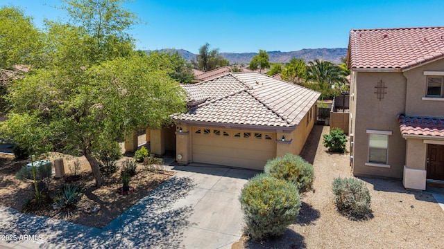 2421 W Romley Rd, Phoenix, AZ 85041 - view of front of house with stucco siding, a garage, a tiled roof, and concrete driveway