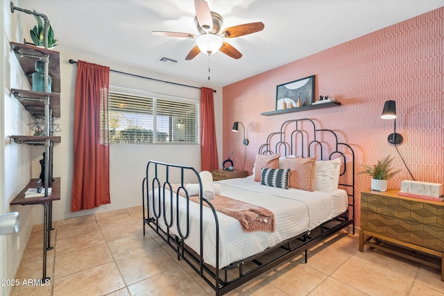 bedroom featuring visible vents, a ceiling fan, and tile patterned flooring