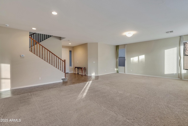 unfurnished living room with carpet