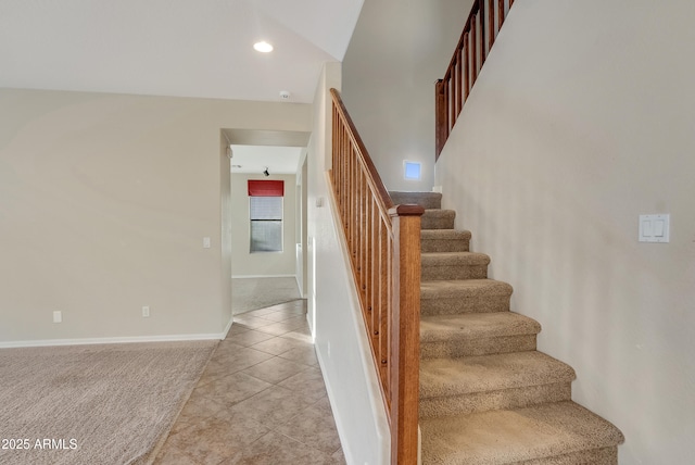 stairs featuring carpet floors